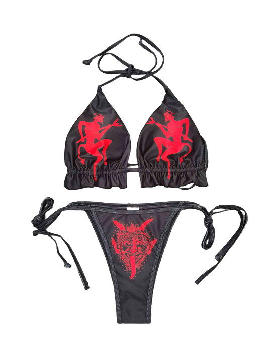 Black bikini set with red illustrations. The top features two dancing Krampus figures, one on each cup, and the bottom features a snarling Krampus face.