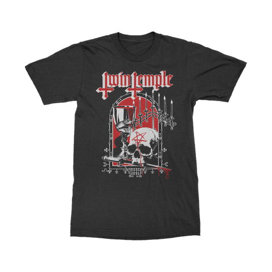 Black t-shirt with a red and white illustration featuring the Twin Temple logo in red at the top. The main image shows a skull with a red pentagram on its forehead, a chalice, four inverted swords, and occult symbols, all on a red background.