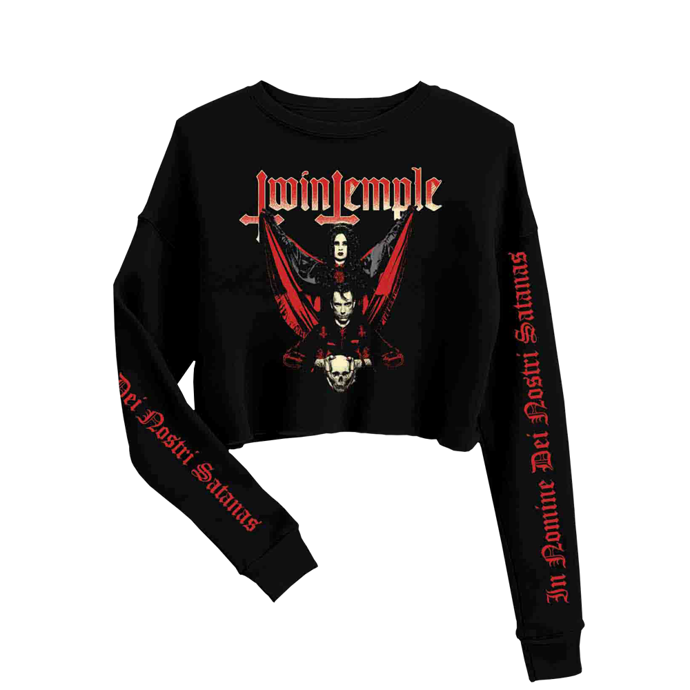 A black cropped long sleeve t-shirt with red and white text and graphics, including a skull and wings design, and the text 'In Nomine Dei Nostri Satanas' on the sleeves.